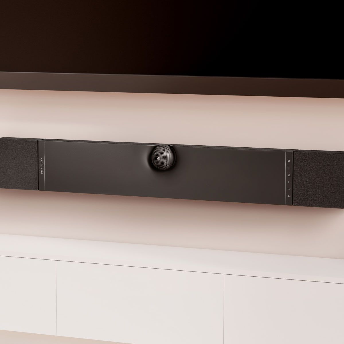 Devialet Dione Dolby Atmos Soundbar, on a wall beneath television in vertical configuration
