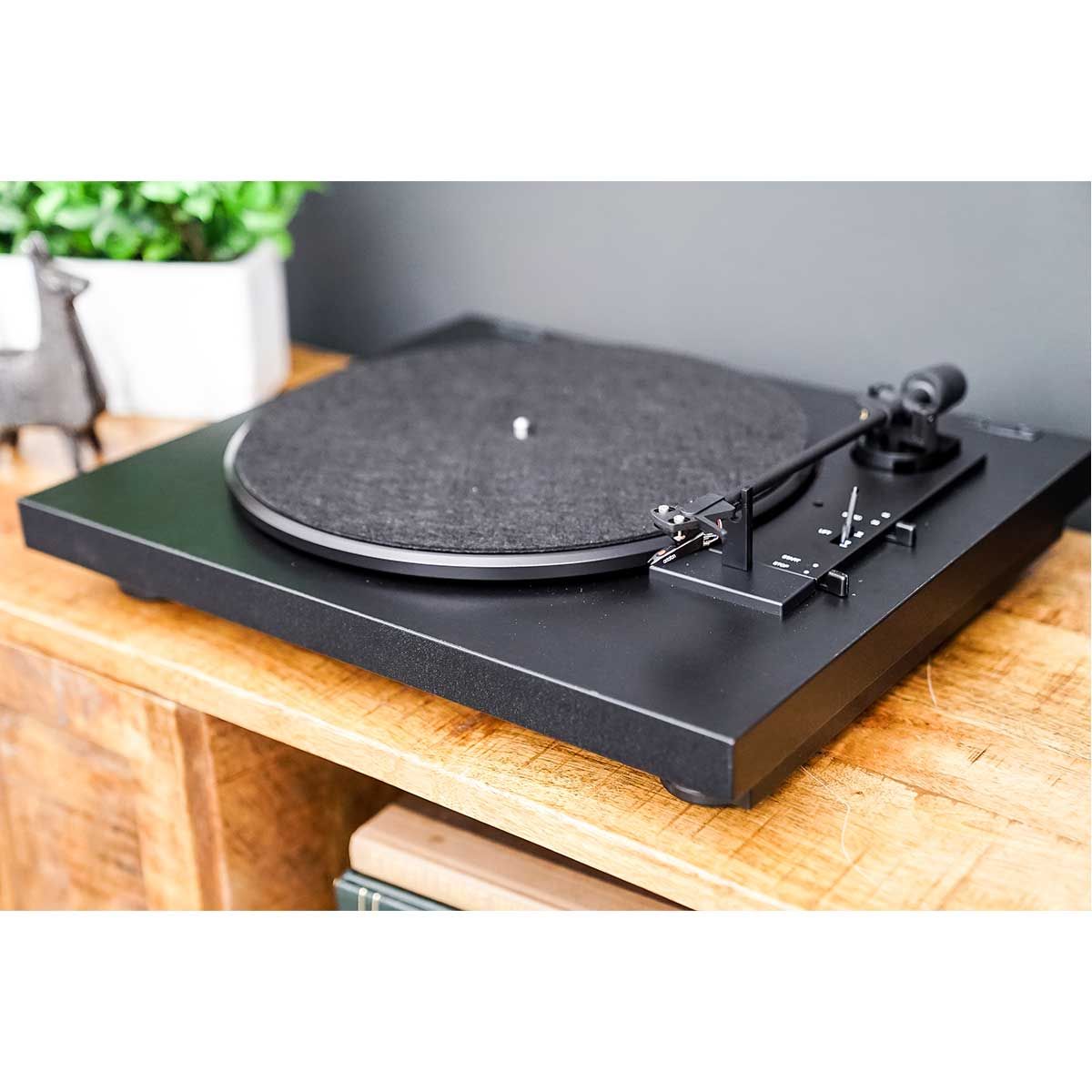 Pro-Ject Automat A1 Automatic Turntable on cabinet with felt mat and tonearm in place