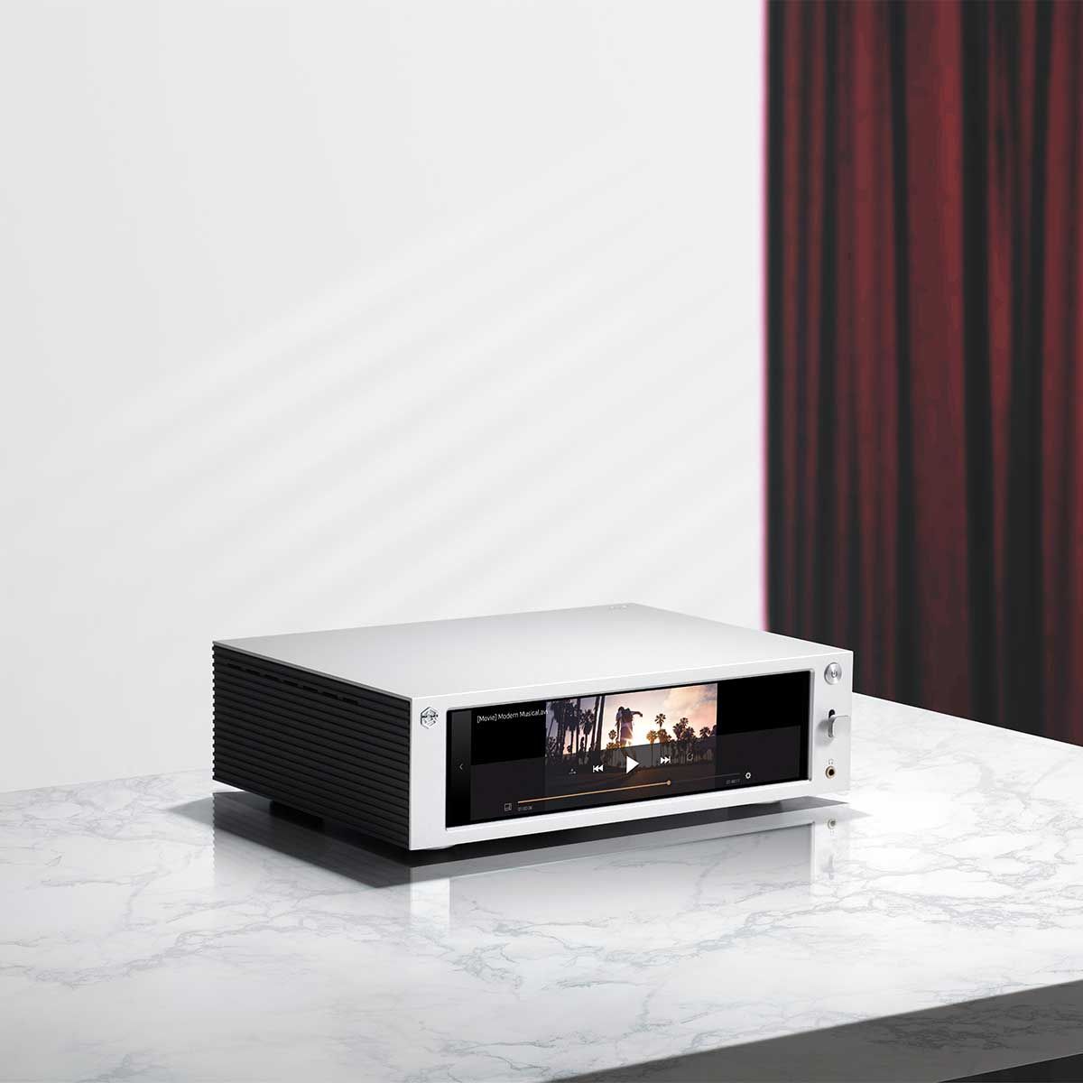 Side angled view of the HiFi Rose RS201E Integrated Amplifier and Network Streamer sitting on top of a tabletop.