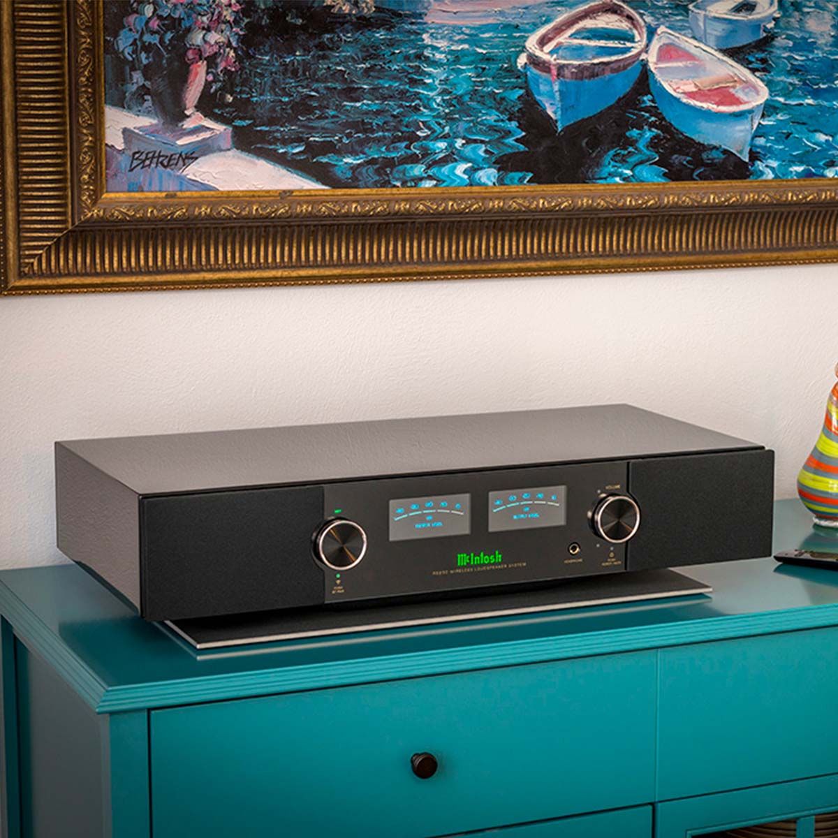 McIntosh RS250 Wireless Speaker, on top of turquoise media console