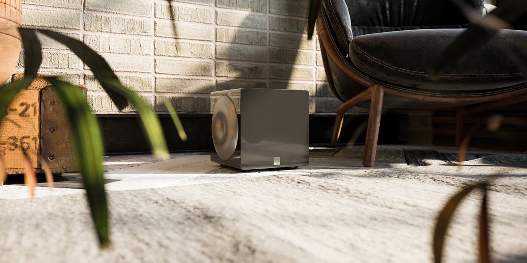 SVS 3000 Micro Subwoofer in a room beside a lounge chair