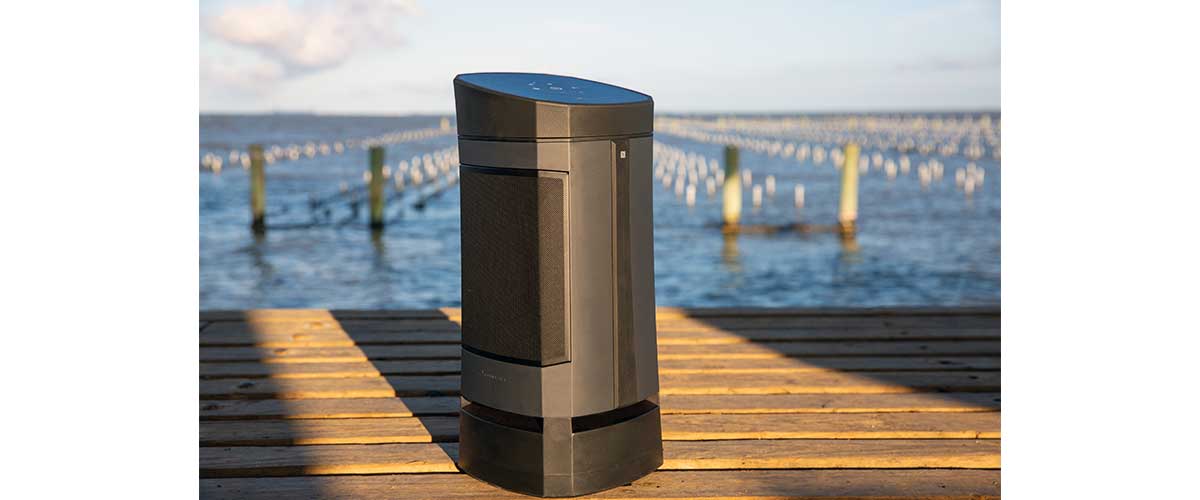 Closed up of the Soundcast VG5 Portable Waterproof Bluetooth Speaker sitting on a boat dock