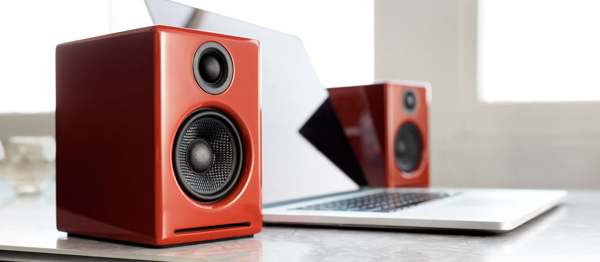 Red A2+ Wireless Speakers connected to laptop