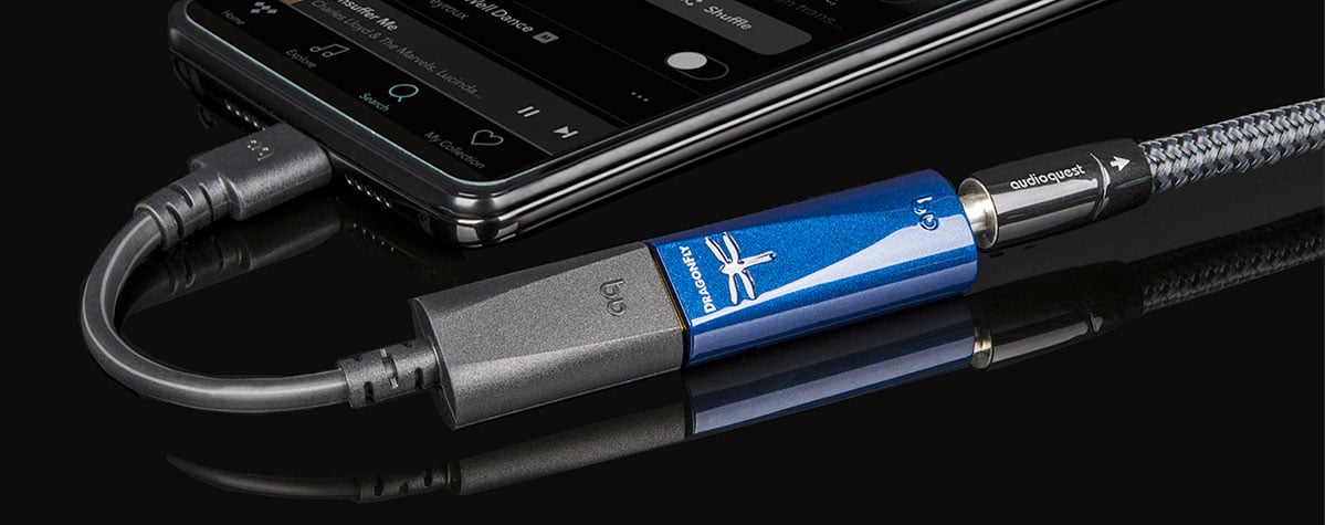 Close up of Audioquest DragonFly Cobalt USB DAC connected to a smartphone.