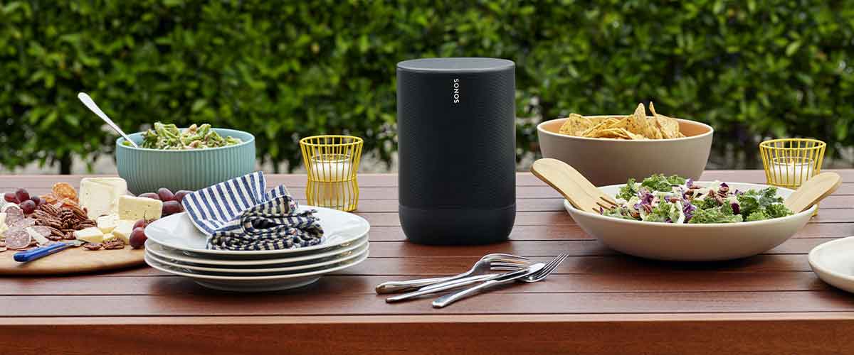 Sonos Move Wireless Battery Powered Smart Speaker on an outdoor picnic table