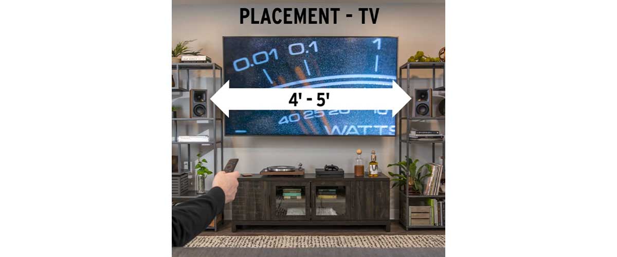a hand model showing how the Klipsch The Fives can be controlled with the remote control as a soundbar replacement using the HDMI ARC connection..
