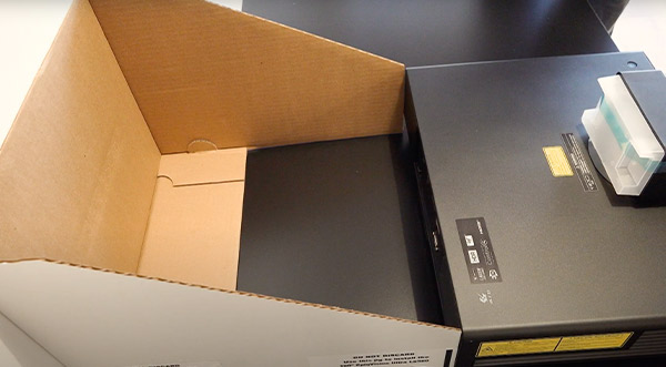 A topographical view of the EPSON LS500 touching the cardboard jig.