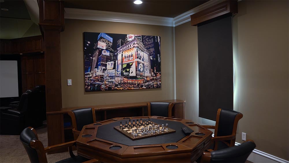 Photo of a poker table in home theater room before high-performance lighting is added