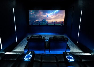 Straight on image of home theater with Thor movie on screen