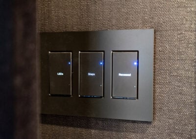 Control4 panel with three switches installed on wall