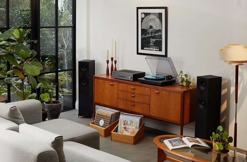 alva tt v2 turntable and cxa81 amplifier on wooden unit, with sx-80 speakers and records in living room