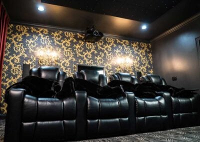 Row of 4 Audio Advice Revolution home theater seats in a home theater