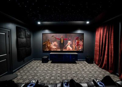 5.2.2 Home theater with two SVS subs and The Greatest Showman playing on Stewart Filmscreen