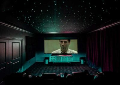 The Maxtrix playing in home theater with star ceiling