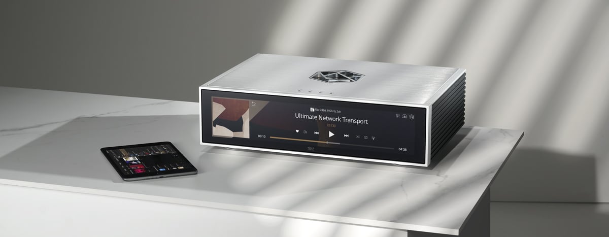 HiFi Rose RS130 in silver on a counter next to an iPad