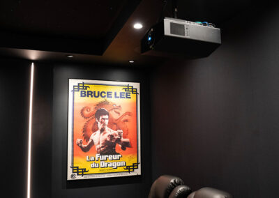 Projector and movie poster in home theater